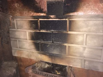 [Hearth.com] 1999 Harman Advance - Flame Lapping brick Backing creating Black Burn Spot!