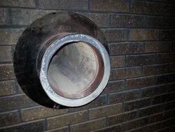 existing flue through brick wall on stove side.jpg
