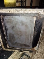 Fireplace Insert Glass Doors...Dirty Glass or Some Type of Metal??