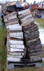 What is the best way to orient the firewood pile.