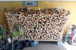 Wood Piled Against House