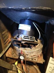 How do I fit my combustion fan in my stove?