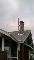 Pre-fab chimney height near existing brick chimney