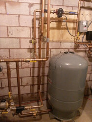 Installing Wood Gassification Boiler With 1000 Gallon Thermal Storage