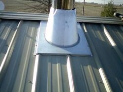 Chimney penetration boot for standing seam metal roof