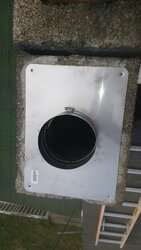 Stainless top plate on concrete chimney block.