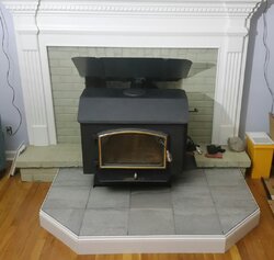 Freestanding stove install venting through masonry fireplace.