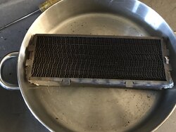 Cleaning a catalytic combustor with vinegar bath