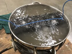 Cleaning a catalytic combustor with vinegar bath
