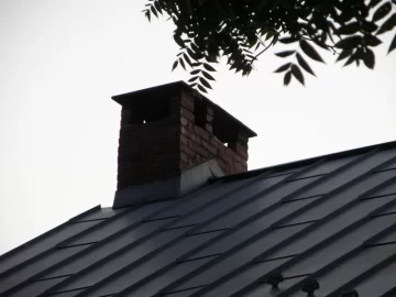 How to securely attach chimney chase cover to the brick of masonry chimneys?