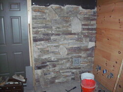 Stone veneer hearth install on painted block wall...need advice