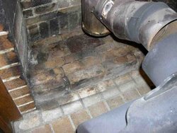 Can an older wood stove be made safer for indoor air quality?