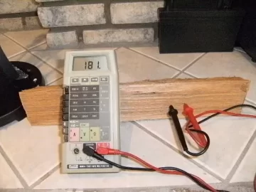 Using a multimeter to measure wood moisture level