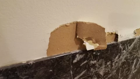 [Hearth.com] Installing Stone Veneer on Wall with Fireplace