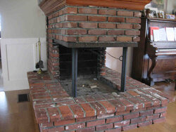 Install woodstove in 3-sided fireplace