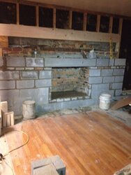 Putting an insert in a masonry fireplace after removing stone face??