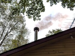 Smoke from chimney WITH hot fire??
