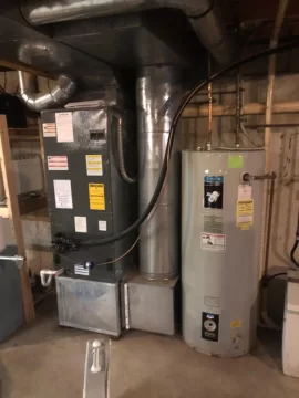 Adding wood heat to an existing electric furnace system