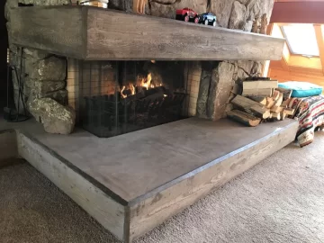 Large open sided concrete fireplace help