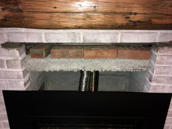 What to do with this gaping hole above gas fireplace insert?