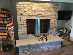 Large open sided concrete fireplace help