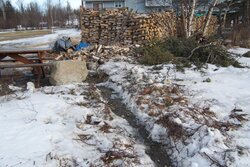 New creek/flood approaches wood pile
