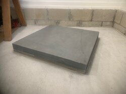 Bedding large slab of bluestone to concrete for woodstove platform