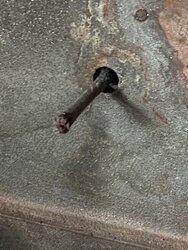 Metal sticking out inside back of stove