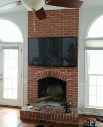Wood-burning insert for arched fireplace