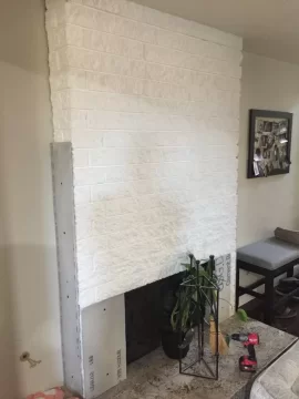 Stacked stone over painted fireplace