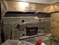 Stacked stone over painted fireplace