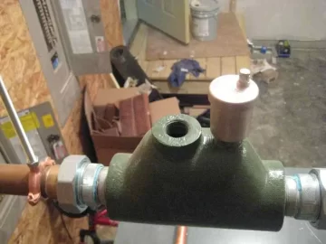 [Hearth.com] What is the silver thingy on the right, and what goes in the hole on the left?