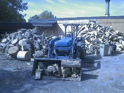 Ford in front of the wood pile.jpg