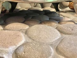 Replacing select rocks from river rock hearth