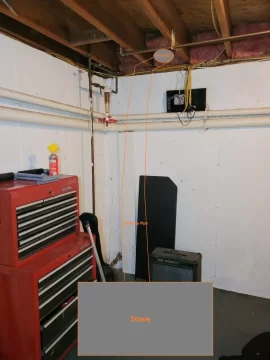 Installing wood stove in unfinished basement: Chimney clearance questions