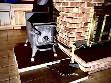 [Hearth.com] 2 small wood stoves  into 1 pipe