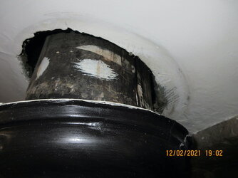 Stovepipe at ceiling.JPG