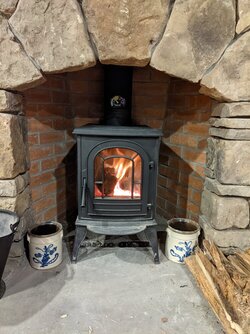 Wood stove clearance in a masonry fireplace
