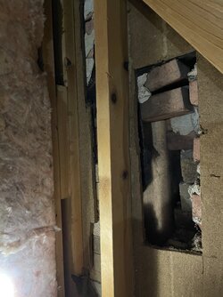 One brick width behind my attic wall and the flue .. a disaster?