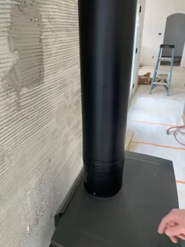 Question about exposed stove pipe on new install