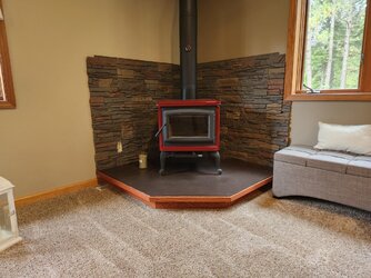 Corner mantel for free standing woodstove
