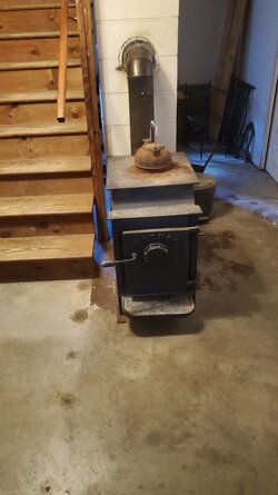 Fire blocking between a wood stove and a wooden stair case.