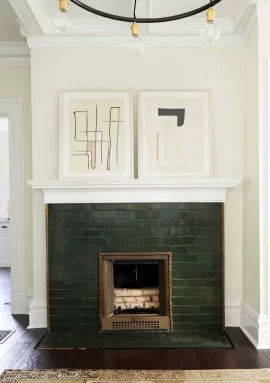 23-a-hunter-green-brick-fireplace-with-copper-detailing-and-abstract-artworks-on-the-mantel-l...jpeg 23-a-hunter-green-brick-fireplace-with-copper-detailing-and-abstract-artworks-on-the-mantel-l...jpeg