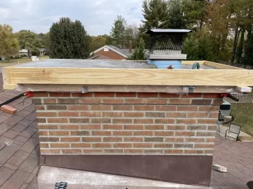 Stainless cover vs full chimney cap over masonry crown