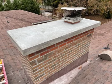 Stainless cover vs full chimney cap over masonry crown