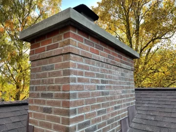 Stainless cover vs full chimney cap over masonry crown