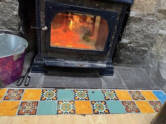 Flooring - Solid wood, engineered or laminate up against hearth?