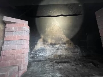 How to fix draw issues - is it this exposed non-insulated chimney?