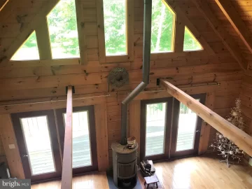 [Hearth.com] My Woodstove single wall pipe is 8 inches from my log walls