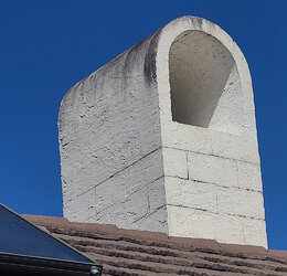 Chimney cinder blocks appearing through stucco